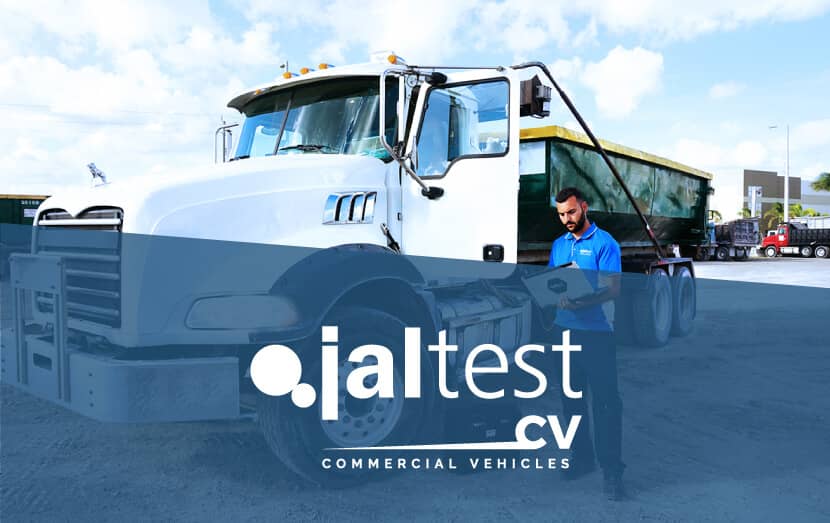 jaltest diagnostic specialist with computer next to commercial vehicle