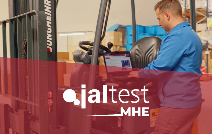 jaltest diagnostic specialist with computer next to forklift material handling equipment