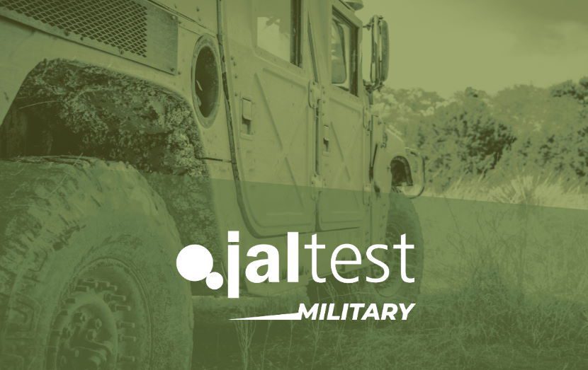 jaltest diagnostic specialist with computer next to military tactical vehicle